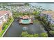 Expansive aerial view showcasing condo building, water view, and community pool at 7903 Seminole Blvd # 2203, Seminole, FL 33772