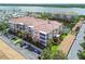 An aerial view of the condo building with a beautiful view of the waterfront at 7903 Seminole Blvd # 2203, Seminole, FL 33772