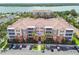An aerial view of the condo building with a beautiful view of the waterfront at 7903 Seminole Blvd # 2203, Seminole, FL 33772