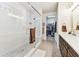 Bright bathroom featuring a glass enclosed shower with dual shower heads and adjacent walk-in closet at 7903 Seminole Blvd # 2203, Seminole, FL 33772