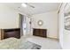 Cozy bedroom with neutral carpet, dark wood dresser, and sliding door closet at 7903 Seminole Blvd # 2203, Seminole, FL 33772