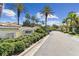 Community entrance featuring a sign, palm trees, and well-maintained greenery for curb appeal at 7903 Seminole Blvd # 2203, Seminole, FL 33772