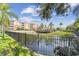 Beautiful apartment complex overlooking a pond with palm trees and a fountain, perfect for tranquil living at 7903 Seminole Blvd # 2203, Seminole, FL 33772