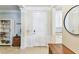 Inviting foyer with neutral tile flooring, white trim and a white entry door, offering a clean and modern aesthetic at 7903 Seminole Blvd # 2203, Seminole, FL 33772