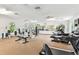 Bright gym with ceiling fans, lots of equipment, and large mirrors at 7903 Seminole Blvd # 2203, Seminole, FL 33772