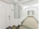 Bright hallway with neutral tones, decorative moldings, and updated lighting, providing a welcoming entry to condo at 7903 Seminole Blvd # 2203, Seminole, FL 33772
