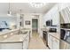 Well-lit kitchen with stainless steel appliances, ample countertop space, and white cabinets at 7903 Seminole Blvd # 2203, Seminole, FL 33772