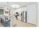 Modern kitchen with stainless steel appliances, white cabinetry, and ample counter space at 7903 Seminole Blvd # 2203, Seminole, FL 33772