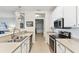 Bright kitchen featuring stainless steel appliances, tile flooring and an open layout at 7903 Seminole Blvd # 2203, Seminole, FL 33772