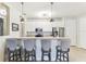 Stylish kitchen with a breakfast bar, pendant lights, and stainless steel appliances at 7903 Seminole Blvd # 2203, Seminole, FL 33772
