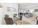 Inviting living room adjacent to the dining area featuring plush seating and contemporary decor at 7903 Seminole Blvd # 2203, Seminole, FL 33772