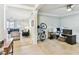 Open-concept living space showcasing a living room and office area with soft carpet and plenty of natural light at 7903 Seminole Blvd # 2203, Seminole, FL 33772