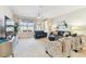 Bright living room with large windows, stylish furnishings, and an inviting atmosphere with ample natural light at 7903 Seminole Blvd # 2203, Seminole, FL 33772
