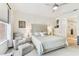 Comfortable main bedroom features neutral tones, a large window, and access to the ensuite bathroom at 7903 Seminole Blvd # 2203, Seminole, FL 33772