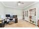 Functional office space featuring carpeted floors, built-in shelving, and ample workspace for productivity at 7903 Seminole Blvd # 2203, Seminole, FL 33772