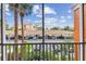 View of the property's parking area showcasing covered parking and well-maintained landscaping at 7903 Seminole Blvd # 2203, Seminole, FL 33772
