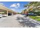 Well-maintained community parking area with ample spaces for residents and visitors, complemented by mature shade trees at 7903 Seminole Blvd # 2203, Seminole, FL 33772
