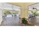 Outdoor pool area features covered seating with tables and chairs overlooking the pool at 7903 Seminole Blvd # 2203, Seminole, FL 33772