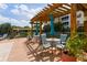 Relaxing pool-side deck with multiple tables and umbrellas to create a tranquil outdoor escape for residents and guests at 7903 Seminole Blvd # 2203, Seminole, FL 33772