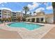 Inviting community pool with ample lounge seating and a covered pavilion for residents to enjoy the Florida sunshine at 7903 Seminole Blvd # 2203, Seminole, FL 33772