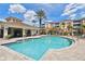 Beautiful community pool featuring a relaxing atmosphere, a covered seating area, and well-maintained brick pool deck at 7903 Seminole Blvd # 2203, Seminole, FL 33772