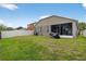 Spacious backyard featuring a well-maintained lawn and a white fence for added privacy at 8620 Sandy Plains Dr, Riverview, FL 33578