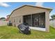 View of the screened-in patio in a spacious backyard at 8620 Sandy Plains Dr, Riverview, FL 33578