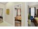 This bedroom features a ceiling fan and a bed with an orange floral pattern at 8620 Sandy Plains Dr, Riverview, FL 33578