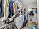 Organized walk-in closet with custom shelving and ample storage space at 8620 Sandy Plains Dr, Riverview, FL 33578