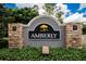 Amberly community sign with stone columns and lush greenery at the base at 8620 Sandy Plains Dr, Riverview, FL 33578