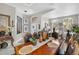 Elegant dining room featuring a large wooden table, ornate chairs, and stylish décor, perfect for entertaining guests at 8620 Sandy Plains Dr, Riverview, FL 33578
