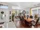Formal dining room featuring dark wood floors, decor and a large window for natural light at 8620 Sandy Plains Dr, Riverview, FL 33578