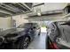 A spacious two-car garage with an automatic door and overhead storage racks at 8620 Sandy Plains Dr, Riverview, FL 33578