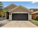 Attractive home with a well-maintained garage and neutral tones providing curb appeal at 8620 Sandy Plains Dr, Riverview, FL 33578