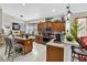 Spacious kitchen with stainless steel appliances, custom cabinets, center island, and eat-in breakfast bar at 8620 Sandy Plains Dr, Riverview, FL 33578
