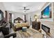 The main bedroom includes decorative touches, tile floors, and a modern fireplace at 8620 Sandy Plains Dr, Riverview, FL 33578