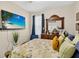 This bedroom features dark wood furniture, a large mirror, and a flat-screen television at 8620 Sandy Plains Dr, Riverview, FL 33578