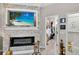 The main bedroom includes a walk-in closet, modern fireplace, and tile floors at 8620 Sandy Plains Dr, Riverview, FL 33578