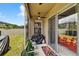 Inviting screened-in patio featuring seating area and backyard access at 8620 Sandy Plains Dr, Riverview, FL 33578