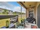 Comfortable screened-in patio with seating area and backyard view at 8620 Sandy Plains Dr, Riverview, FL 33578