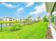 A lovely view of the pond from the beautiful green backyard at 8717 Sanders Tree Loop, Wesley Chapel, FL 33545