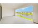 Open balcony with a view of a pond and neighborhood homes at 8717 Sanders Tree Loop, Wesley Chapel, FL 33545