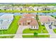Stunning waterfront home with lush landscaping and a paver driveway, in a quiet neighborhood at 8717 Sanders Tree Loop, Wesley Chapel, FL 33545