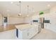 Spacious kitchen with center island, stainless steel appliances, and open floor plan at 8717 Sanders Tree Loop, Wesley Chapel, FL 33545