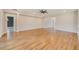 Huge living room with hardwood floors and neutral paint at 8717 Sanders Tree Loop, Wesley Chapel, FL 33545