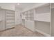 Spacious walk-in closet with built-in shelving and drawers offers ample storage at 8717 Sanders Tree Loop, Wesley Chapel, FL 33545
