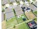Aerial view of multiple fenced backyards, some with pools and trampolines at 9650 Sage Creek Dr, Ruskin, FL 33573