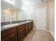 Bathroom featuring double sinks with granite counters, tile floor, and a shower with tub at 9650 Sage Creek Dr, Ruskin, FL 33573