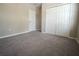 Bedroom featuring neutral paint, a closet, and neutral carpeting at 9650 Sage Creek Dr, Ruskin, FL 33573