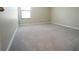 Carpeted bedroom featuring one window for natural light at 9650 Sage Creek Dr, Ruskin, FL 33573